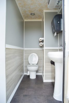 Climate Controlled Comforts of Home 2-Stall Restroom Trailer interior with toilet