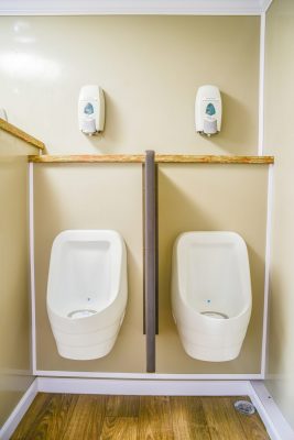 Jag Residence Restroom Trailer 4+4 interior with two urinals